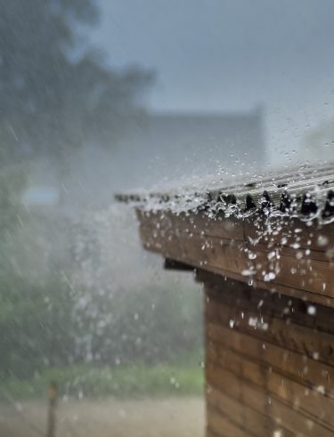 rain flows down from a roof down